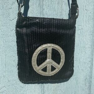 Deb & Dave Black Sequins Decorated crossbody bag with a peace sign emblem